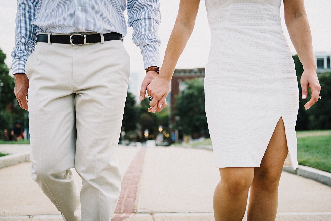 A couple walking together, holding hands